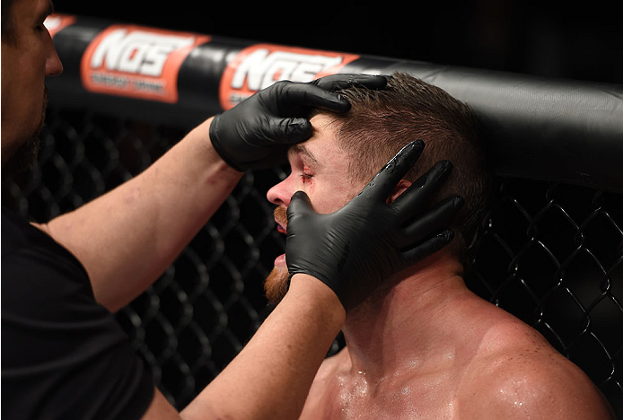LAS VEGAS, NEVADA - DECEMBER 12: Daron Cruickshank walks to his corner after an accidental eye poke from KJ Noons in their lightweight fight during The Ultimate Fighter Finale event inside the Pearl concert theater at the Palms Casino Resort on December 1