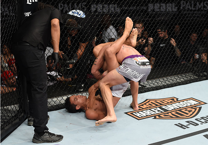 LAS VEGAS, NEVADA - DECEMBER 12: (R-L) Charles Oliveira attempts to submit Jeremy Stephens in their lightweight fight during The Ultimate Fighter Finale event inside the Pearl concert theater at the Palms Casino Resort on December 12, 2014 in Las Vegas,
