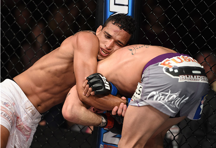 LAS VEGAS, NEVADA - DECEMBER 12: (L-R) Charles Oliveira attempts to submit Jeremy Stephens in their lightweight fight during The Ultimate Fighter Finale event inside the Pearl concert theater at the Palms Casino Resort on December 12, 2014 in Las Vegas,