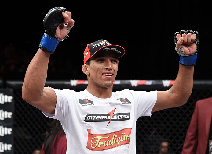 LAS VEGAS, NEVADA - DECEMBER 12: Charles Oliveira raises his hands after his fight against Jeremy Stephens in their lightweight fight during The Ultimate Fighter Finale event inside the Pearl concert theater at the Palms Casino Resort on December 12, 2014