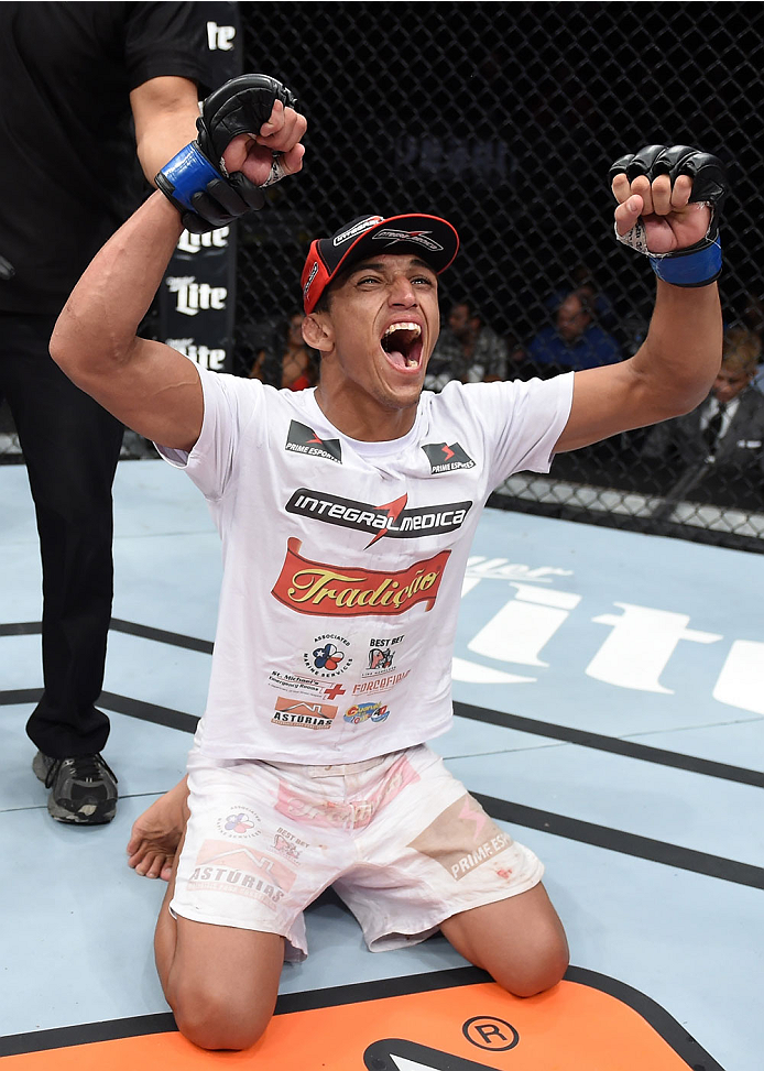 LAS VEGAS, NEVADA - DECEMBER 12: Charles Oliveira celebrates his victory over Jeremy Stephens in their lightweight fight during The Ultimate Fighter Finale event inside the Pearl concert theater at the Palms Casino Resort on December 12, 2014 in Las Vegas