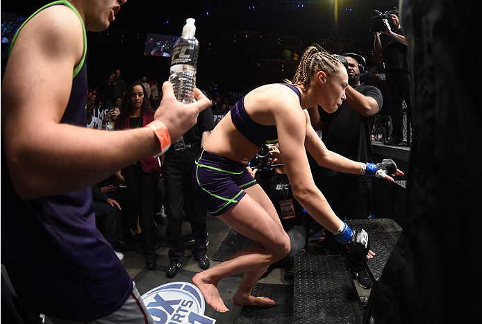 LAS VEGAS, NEVADA - DECEMBER 12: Rose Namajunas enters the Octagon before facing Carla Esparza in their strawweight championship fight during The Ultimate Fighter Finale event inside the Pearl concert theater at the Palms Casino Resort on December 12, 201