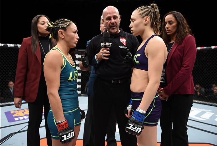 LAS VEGAS, NEVADA - DECEMBER 12: (R-L) Rose Namajunas and Carla Esparza face-off in their strawweight championship fight during The Ultimate Fighter Finale event inside the Pearl concert theater at the Palms Casino Resort on December 12, 2014 in Las Vegas