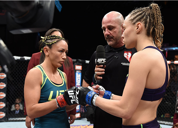 LAS VEGAS, NEVADA - DECEMBER 12: (R-L) Rose Namajunas and Carla Esparza face-off in their strawweight championship fight during The Ultimate Fighter Finale event inside the Pearl concert theater at the Palms Casino Resort on December 12, 2014 in Las Vegas