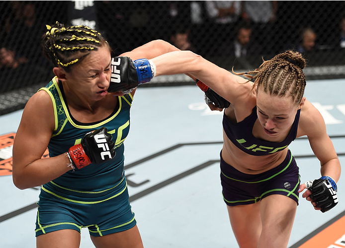 LAS VEGAS, NEVADA - DECEMBER 12: (L-R) Rose Namajunas punches Carla Esparza in their strawweight championship fight during The Ultimate Fighter Finale event inside the Pearl concert theater at the Palms Casino Resort on December 12, 2014 in Las Vegas, Nev