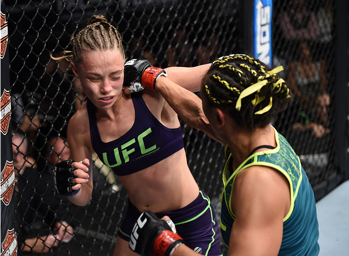 LAS VEGAS, NEVADA - DECEMBER 12: (R-L) Carla Esparza punches Rose Namajunas in their strawweight championship fight during The Ultimate Fighter Finale event inside the Pearl concert theater at the Palms Casino Resort on December 12, 2014 in Las Vegas, Nev