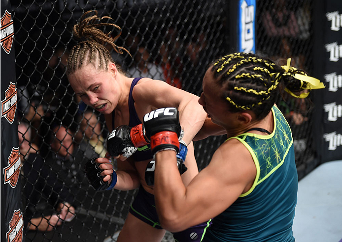 LAS VEGAS, NEVADA - DECEMBER 12: (L-R) Rose Namajunas exchanges punches with Carla Esparza in their strawweight championship fight during The Ultimate Fighter Finale event inside the Pearl concert theater at the Palms Casino Resort on December 12, 2014 in