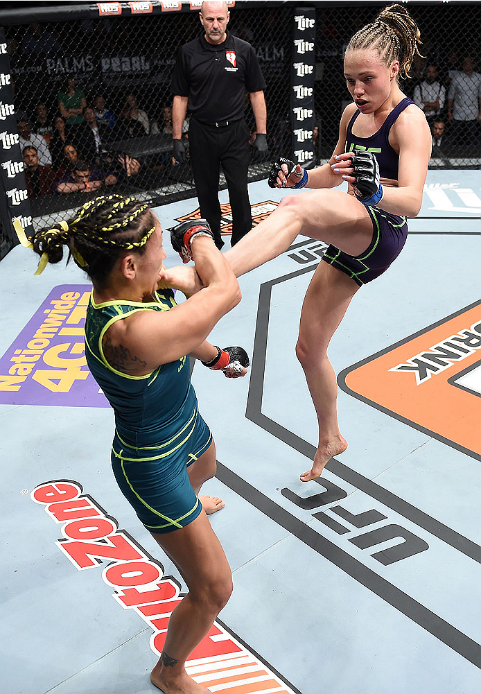 LAS VEGAS, NEVADA - DECEMBER 12: (R-L) Rose Namajunas kicks Carla Esparza in their strawweight championship fight during The Ultimate Fighter Finale event inside the Pearl concert theater at the Palms Casino Resort on December 12, 2014 in Las Vegas, Neva