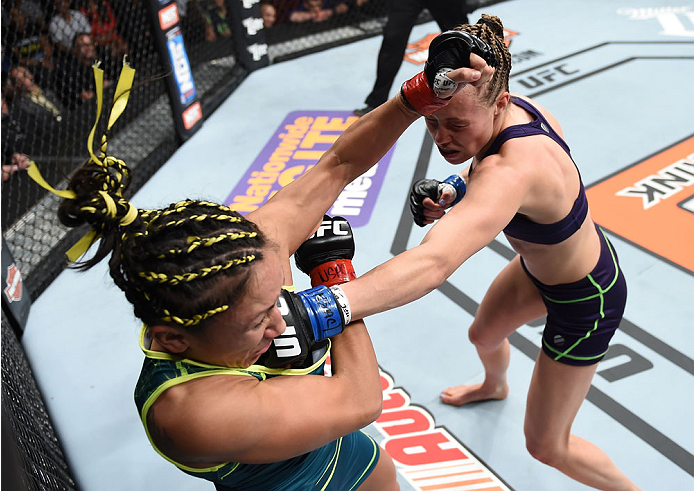 LAS VEGAS, NEVADA - DECEMBER 12: (R-L) Rose Namajunas punches Carla Esparza in their strawweight championship fight during The Ultimate Fighter Finale event inside the Pearl concert theater at the Palms Casino Resort on December 12, 2014 in Las Vegas, Ne
