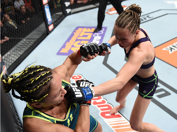 LAS VEGAS, NEVADA - DECEMBER 12: (R-L) Rose Namajunas punches Carla Esparza in their strawweight championship fight during The Ultimate Fighter Finale event inside the Pearl concert theater at the Palms Casino Resort on December 12, 2014 in Las Vegas, Ne