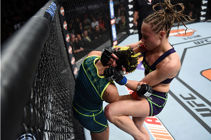 LAS VEGAS, NEVADA - DECEMBER 12: (R-L) Rose Namajunas knees Carla Esparza in their strawweight championship fight during The Ultimate Fighter Finale event inside the Pearl concert theater at the Palms Casino Resort on December 12, 2014 in Las Vegas, Neva