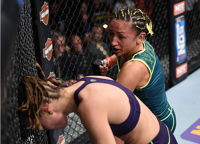 LAS VEGAS, NEVADA - DECEMBER 12: (R-L) Carla Esparza punches Rose Namajunas in their strawweight championship fight during The Ultimate Fighter Finale event inside the Pearl concert theater at the Palms Casino Resort on December 12, 2014 in Las Vegas, Ne