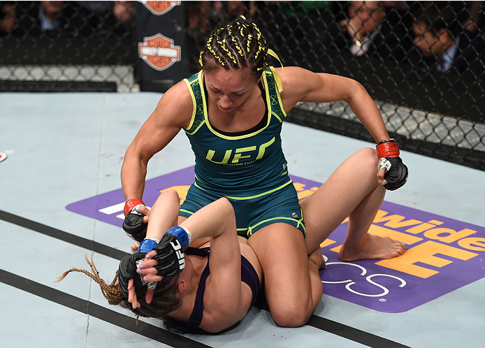 LAS VEGAS, NEVADA - DECEMBER 12: Carla Esparza (top) punches Rose Namajunas in their strawweight championship fight during The Ultimate Fighter Finale event inside the Pearl
