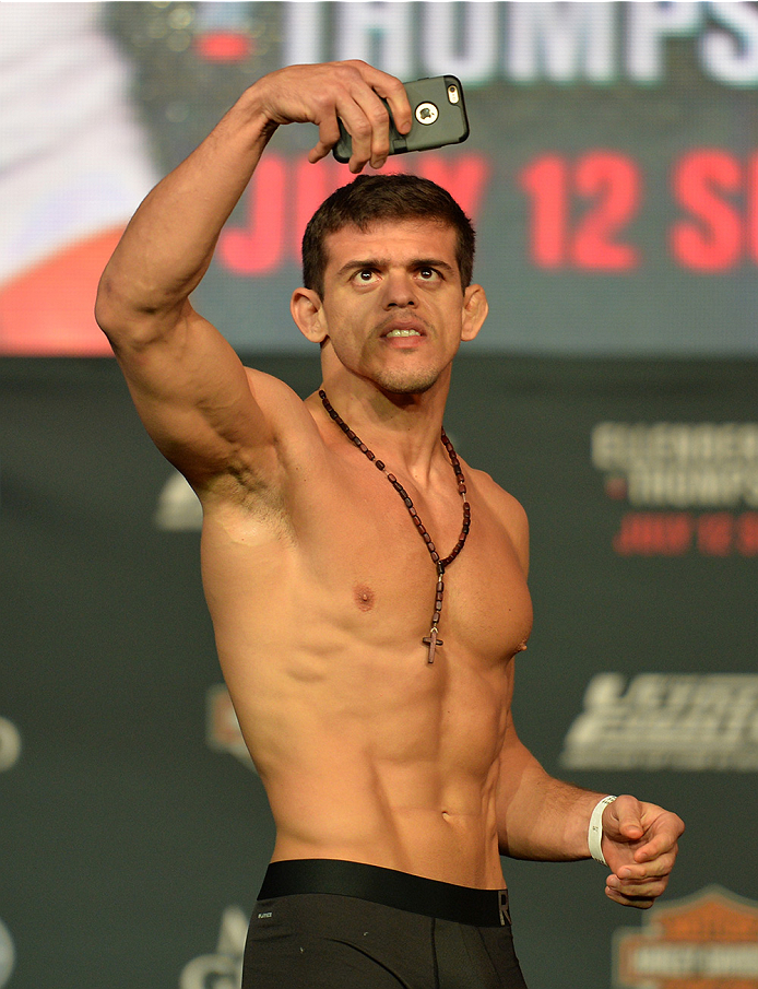 LAS VEGAS, NEVADA - JULY 11:   Caio Magalhaes takes a selfie on stage during the TUF 21 Finale Weigh-in at the UFC Fan Expo in the Sands Expo and Convention Center on July 11, 2015 in Las Vegas Nevada. (Photo by Brandon Magnus/Zuffa LLC/Zuffa LLC via Gett