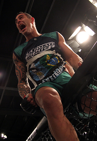 SAO PAULO, BRAZIL - FEBRUARY 11:  Santiago Ponzinibbio reacts after defeating Marcio "Pedra" Santos in their preliminary fight during filming of season two of The Ultimate Fighter Brazil on February 11, 2013 in Sao Paulo, Brazil. (Photo by Luiz Pires Dias