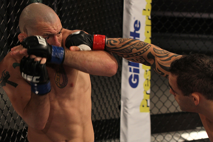 SAO PAULO, BRAZIL - FEBRUARY 11: (R-L) Santiago Ponzinibbio punches Marcio "Pedra" Santos in their preliminary fight during filming of season two of The Ultimate Fighter Brazil on February 11, 2013 in Sao Paulo, Brazil. (Photo by Luiz Pires Dias/Zuffa LL