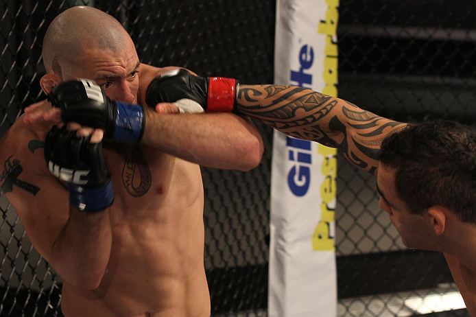 SAO PAULO, BRAZIL - FEBRUARY 11:  (R-L) Santiago Ponzinibbio punches Marcio "Pedra" Santos in their preliminary fight during filming of season two of The Ultimate Fighter Brazil on February 11, 2013 in Sao Paulo, Brazil. (Photo by Luiz Pires Dias/Zuffa LL