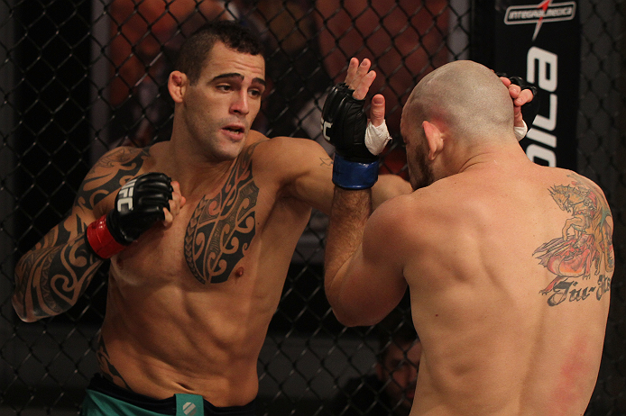SAO PAULO, BRAZIL - FEBRUARY 11: (L-R) Santiago Ponzinibbio punches Marcio "Pedra" Santos in their preliminary fight during filming of season two of The Ultimate Fighter Brazil on February 11, 2013 in Sao Paulo, Brazil. (Photo by Luiz Pires Dias/Zuffa LL
