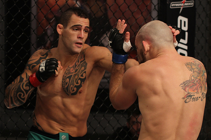 SAO PAULO, BRAZIL - FEBRUARY 11:  (L-R) Santiago Ponzinibbio punches Marcio "Pedra" Santos in their preliminary fight during filming of season two of The Ultimate Fighter Brazil on February 11, 2013 in Sao Paulo, Brazil. (Photo by Luiz Pires Dias/Zuffa LL