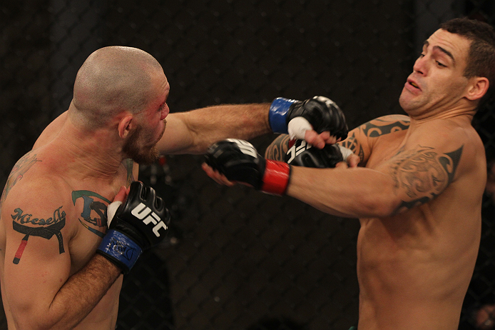 SAO PAULO, BRAZIL - FEBRUARY 11: (L-R) Marcio "Pedra" Santos punches Santiago Ponzinibbio in their preliminary fight during filming of season two of The Ultimate Fighter Brazil on February 11, 2013 in Sao Paulo, Brazil. (Photo by Luiz Pires Dias/Zuffa LL