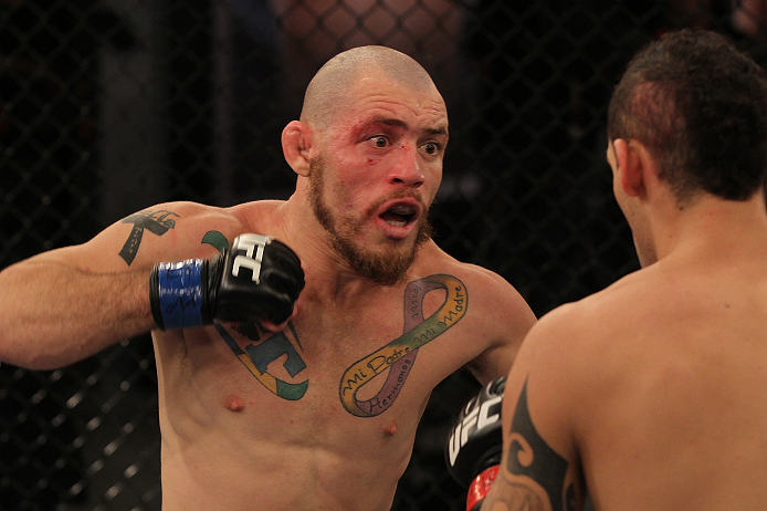 SAO PAULO, BRAZIL - FEBRUARY 11: (L-R) Marcio "Pedra" Santos punches Santiago Ponzinibbio in their preliminary fight during filming of season two of The Ultimate Fighter Brazil on February 11, 2013 in Sao Paulo, Brazil. (Photo by Luiz Pires Dias/Zuffa LL