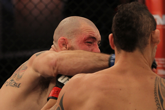 SAO PAULO, BRAZIL - FEBRUARY 11: (L-R) Marcio "Pedra" Santos punches Santiago Ponzinibbio in their preliminary fight during filming of season two of The Ultimate Fighter Brazil on February 11, 2013 in Sao Paulo, Brazil. (Photo by Luiz Pires Dias/Zuffa LL