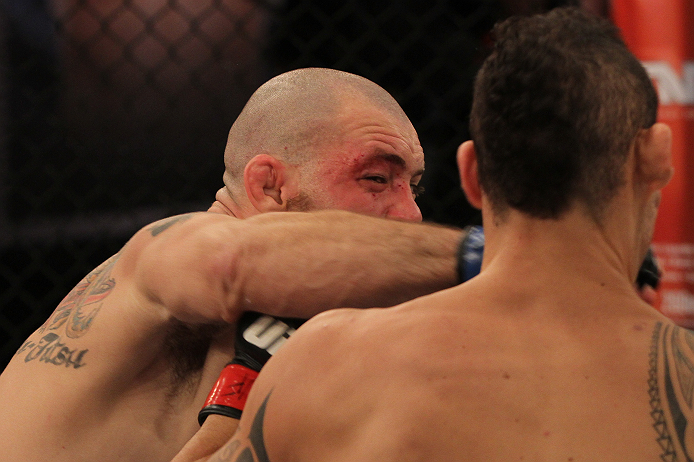 SAO PAULO, BRAZIL - FEBRUARY 11:  (L-R) Marcio "Pedra" Santos punches Santiago Ponzinibbio in their preliminary fight during filming of season two of The Ultimate Fighter Brazil on February 11, 2013 in Sao Paulo, Brazil. (Photo by Luiz Pires Dias/Zuffa LL