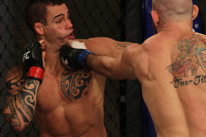 SAO PAULO, BRAZIL - FEBRUARY 11: (R-L) Marcio "Pedra" Santos punches Santiago Ponzinibbio in their preliminary fight during filming of season two of The Ultimate Fighter Brazil on February 11, 2013 in Sao Paulo, Brazil. (Photo by Luiz Pires Dias/Zuffa LL