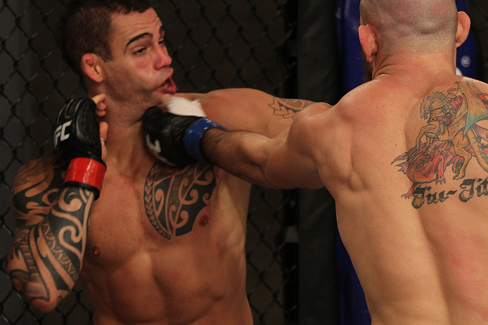 SAO PAULO, BRAZIL - FEBRUARY 11:  (R-L) Marcio "Pedra" Santos punches Santiago Ponzinibbio in their preliminary fight during filming of season two of The Ultimate Fighter Brazil on February 11, 2013 in Sao Paulo, Brazil. (Photo by Luiz Pires Dias/Zuffa LL