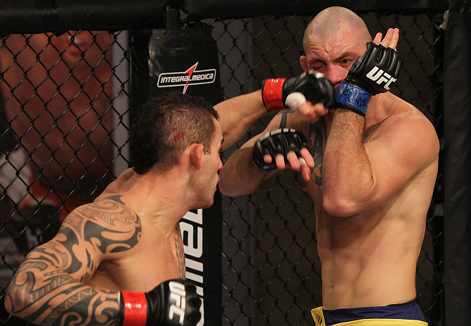 SAO PAULO, BRAZIL - FEBRUARY 11: (L-R) Santiago Ponzinibbio punches Marcio "Pedra" Santos in their preliminary fight during filming of season two of The Ultimate Fighter Brazil on February 11, 2013 in Sao Paulo, Brazil. (Photo by Luiz Pires Dias/Zuffa LL