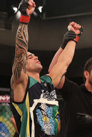 SAO PAULO, BRAZIL - FEBRUARY 11:  Santiago Ponzinibbio reacts after defeating Marcio "Pedra" Santos in their preliminary fight during filming of season two of The Ultimate Fighter Brazil on February 11, 2013 in Sao Paulo, Brazil. (Photo by Luiz Pires Dias