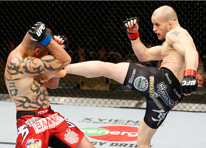 QUEBEC CITY, CANADA - APRIL 16:  (R-L) Mitch Gagnon kicks Tim Gorman in their bantamweight fight during the TUF Nations Finale at Colisee Pepsi on April 16, 2014 in Quebec City, Quebec, Canada. (Photo by Josh Hedges/Zuffa LLC/Zuffa LLC via Getty Images)