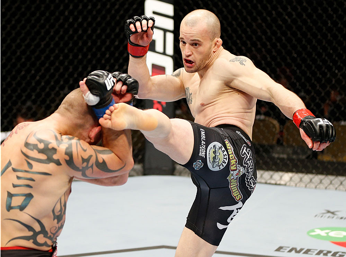 QUEBEC CITY, CANADA - APRIL 16:  (R-L) Mitch Gagnon kicks Tim Gorman in their bantamweight fight during the TUF Nations Finale at Colisee Pepsi on April 16, 2014 in Quebec City, Quebec, Canada. (Photo by Josh Hedges/Zuffa LLC/Zuffa LLC via Getty Images)