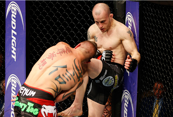 QUEBEC CITY, CANADA - APRIL 16:  (R-L) Mitch Gagnon knees Tim Gorman in their bantamweight fight during the TUF Nations Finale at Colisee Pepsi on April 16, 2014 in Quebec City, Quebec, Canada. (Photo by Josh Hedges/Zuffa LLC/Zuffa LLC via Getty Images)