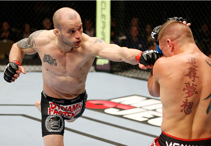 QUEBEC CITY, CANADA - APRIL 16:  (L-R) Mitch Gagnon punches Tim Gorman in their bantamweight fight during the TUF Nations Finale at Colisee Pepsi on April 16, 2014 in Quebec City, Quebec, Canada. (Photo by Josh Hedges/Zuffa LLC/Zuffa LLC via Getty Images)