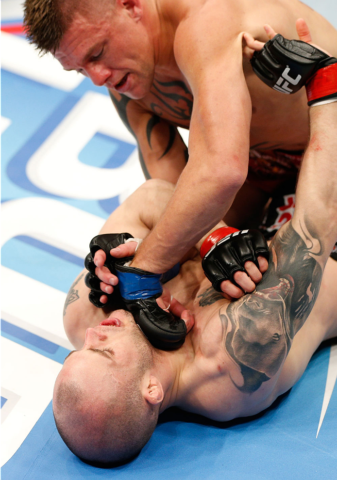 QUEBEC CITY, CANADA - APRIL 16:  (R-L) Tim Gorman punches Mitch Gagnon in their bantamweight fight during the TUF Nations Finale at Colisee Pepsi on April 16, 2014 in Quebec City, Quebec, Canada. (Photo by Josh Hedges/Zuffa LLC/Zuffa LLC via Getty Images)