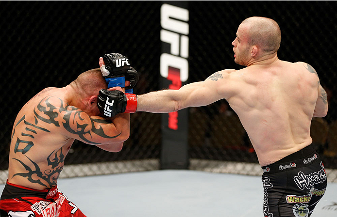 QUEBEC CITY, CANADA - APRIL 16:  (R-L) Mitch Gagnon punches Tim Gorman in their bantamweight fight during the TUF Nations Finale at Colisee Pepsi on April 16, 2014 in Quebec City, Quebec, Canada. (Photo by Josh Hedges/Zuffa LLC/Zuffa LLC via Getty Images)