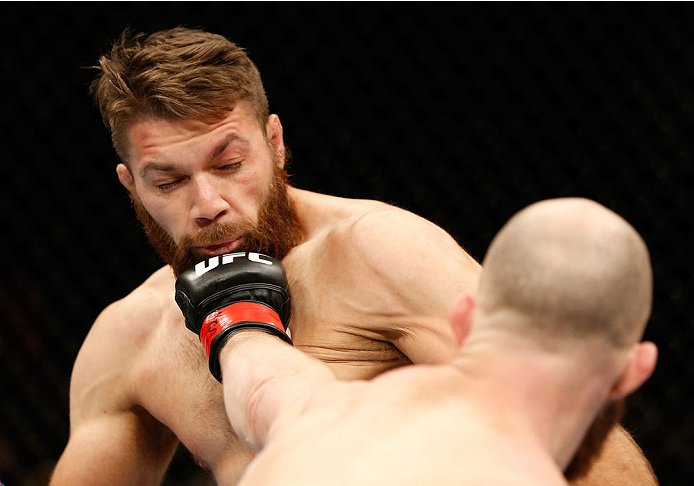 QUEBEC CITY, CANADA - APRIL 16:  (R-L) Richard Walsh punches Chris Indich in their welterweight fight during the TUF Nations Finale at Colisee Pepsi on April 16, 2014 in Quebec City, Quebec, Canada. (Photo by Josh Hedges/Zuffa LLC/Zuffa LLC via Getty Imag