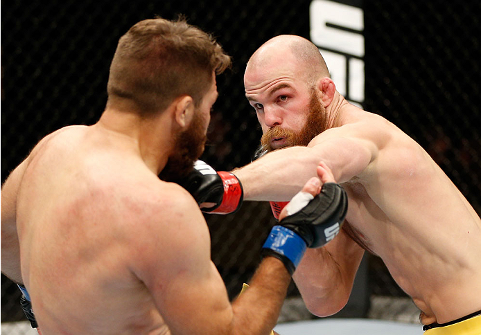 QUEBEC CITY, CANADA - APRIL 16:  (R-L) Richard Walsh punches Chris Indich in their welterweight fight during the TUF Nations Finale at Colisee Pepsi on April 16, 2014 in Quebec City, Quebec, Canada. (Photo by Josh Hedges/Zuffa LLC/Zuffa LLC via Getty Imag