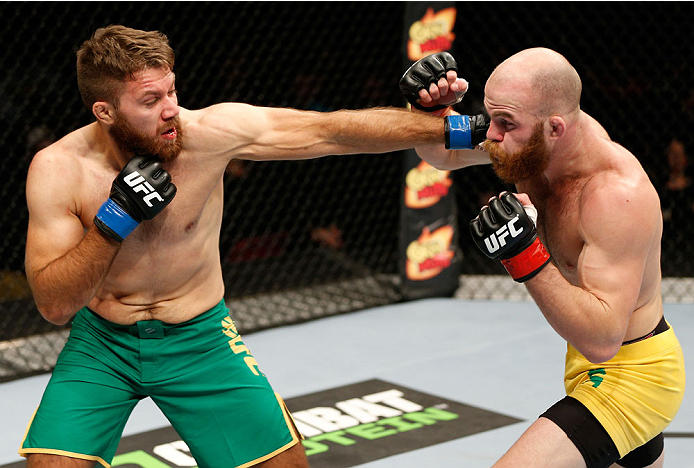 QUEBEC CITY, CANADA - APRIL 16:  (L-R) Chris Indich punches Richard Walsh in their welterweight fight during the TUF Nations Finale at Colisee Pepsi on April 16, 2014 in Quebec City, Quebec, Canada. (Photo by Josh Hedges/Zuffa LLC/Zuffa LLC via Getty Imag