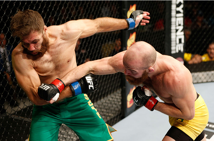 QUEBEC CITY, CANADA - APRIL 16:  (R-L) Richard Walsh punches Chris Indich in their welterweight fight during the TUF Nations Finale at Colisee Pepsi on April 16, 2014 in Quebec City, Quebec, Canada. (Photo by Josh Hedges/Zuffa LLC/Zuffa LLC via Getty Imag