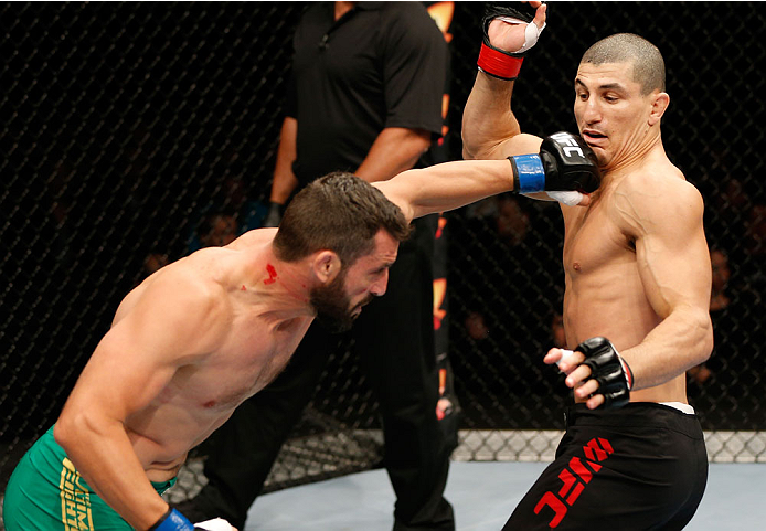 QUEBEC CITY, CANADA - APRIL 16:  (L-R) Vik Grujic punches Nordine Taleb in their middleweight fight during the TUF Nations Finale at Colisee Pepsi on April 16, 2014 in Quebec City, Quebec, Canada. (Photo by Josh Hedges/Zuffa LLC/Zuffa LLC via Getty Images