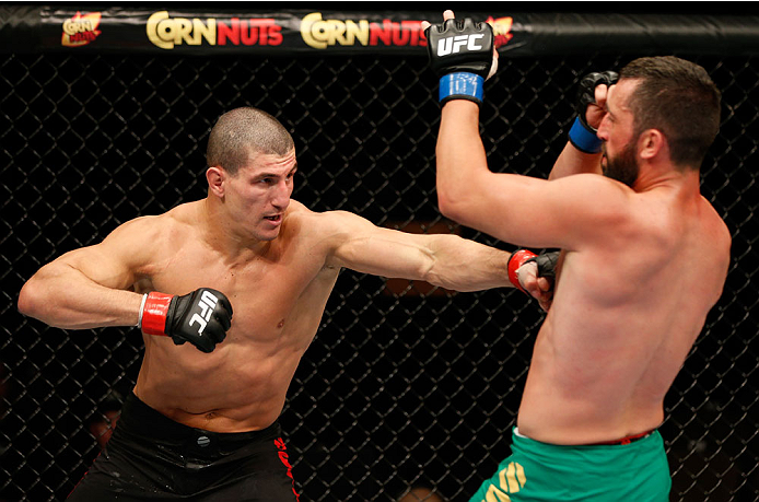 QUEBEC CITY, CANADA - APRIL 16:  (L-R) Nordine Taleb punches Vik Grujic in their middleweight fight during the TUF Nations Finale at Colisee Pepsi on April 16, 2014 in Quebec City, Quebec, Canada. (Photo by Josh Hedges/Zuffa LLC/Zuffa LLC via Getty Images