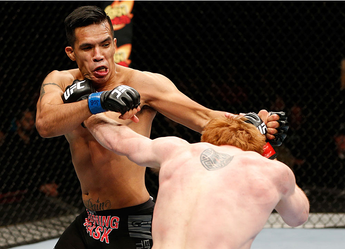 QUEBEC CITY, CANADA - APRIL 16:  (L-R) Mike de la Torre and Mark Bocek trade punches in their lightweight fight during the TUF Nations Finale at Colisee Pepsi on April 16, 2014 in Quebec City, Quebec, Canada. (Photo by Josh Hedges/Zuffa LLC/Zuffa LLC via 