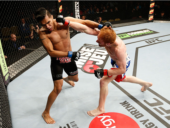 QUEBEC CITY, CANADA - APRIL 16: (R-L) Mark Bocek punches Mike de la Torre in their lightweight fight during the TUF Nations Finale at Colisee Pepsi on April 16, 2014 in Quebec City, Quebec, Canada. (Photo by Josh Hedges/Zuffa LLC/Zuffa LLC via Getty Imag