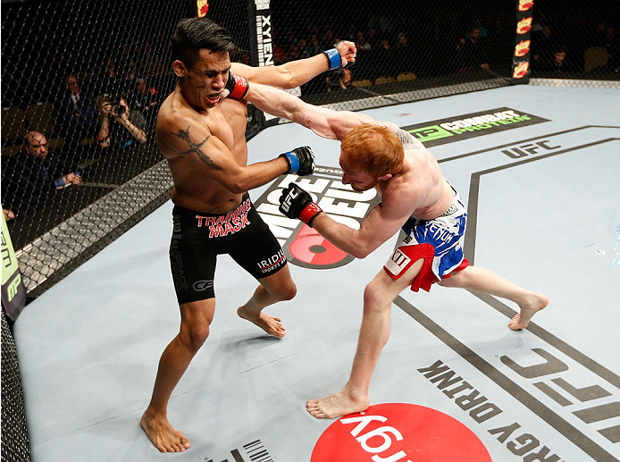 QUEBEC CITY, CANADA - APRIL 16:  (R-L) Mark Bocek punches Mike de la Torre in their lightweight fight during the TUF Nations Finale at Colisee Pepsi on April 16, 2014 in Quebec City, Quebec, Canada. (Photo by Josh Hedges/Zuffa LLC/Zuffa LLC via Getty Imag