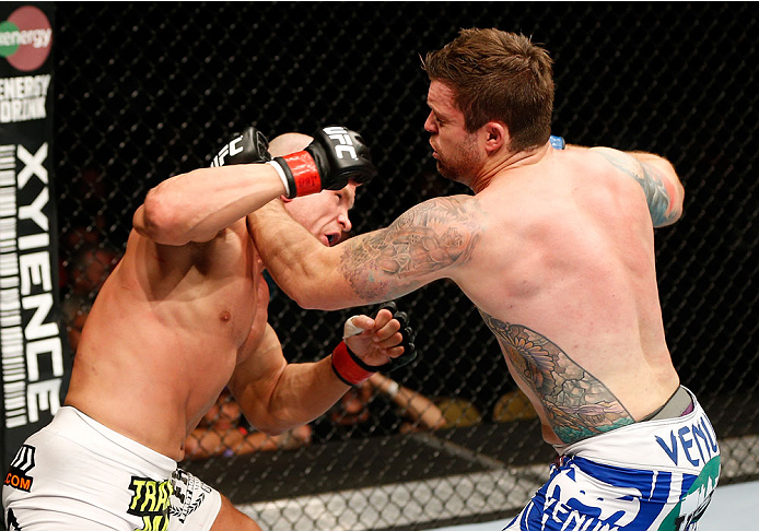 QUEBEC CITY, CANADA - APRIL 16: (L-R) Ryan Jimmo lands a right hand, knocking out Sean O'Connell in their light heavyweight fight during the TUF Nations Finale at Colisee Pepsi on April 16, 2014 in Quebec City, Quebec, Canada. (Photo by Josh Hedges/Zuffa