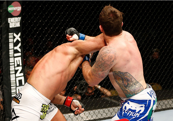 QUEBEC CITY, CANADA - APRIL 16:  (L-R) Ryan Jimmo lands a right hand, knocking out Sean O'Connell in their light heavyweight fight during the TUF Nations Finale at Colisee Pepsi on April 16, 2014 in Quebec City, Quebec, Canada. (Photo by Josh Hedges/Zuffa