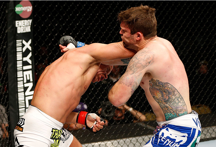 QUEBEC CITY, CANADA - APRIL 16:  (L-R) Ryan Jimmo lands a right hand, knocking out Sean O'Connell in their light heavyweight fight during the TUF Nations Finale at Colisee Pepsi on April 16, 2014 in Quebec City, Quebec, Canada. (Photo by Josh Hedges/Zuffa