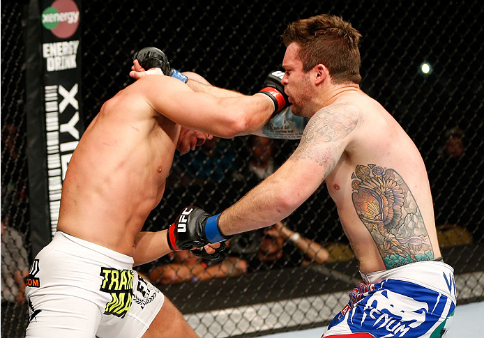 QUEBEC CITY, CANADA - APRIL 16:  (L-R) Ryan Jimmo lands a right hand, knocking out Sean O'Connell in their light heavyweight fight during the TUF Nations Finale at Colisee Pepsi on April 16, 2014 in Quebec City, Quebec, Canada. (Photo by Josh Hedges/Zuffa